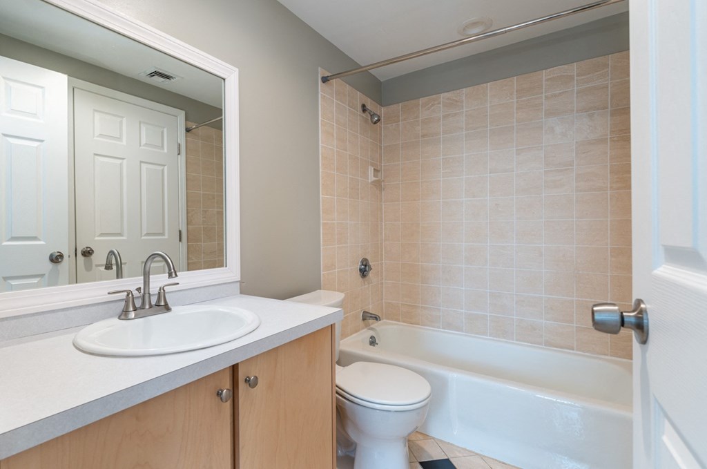 Bathroom with a sink toilet and bathtub