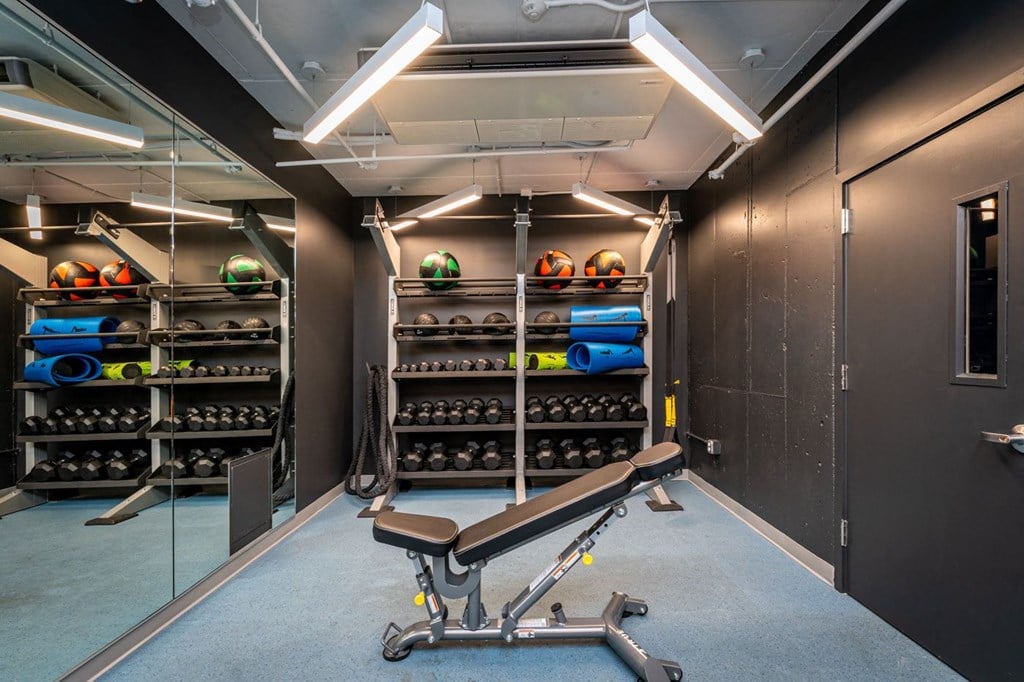 fitness center bench and weight rack at Union 346, Somerville, MA