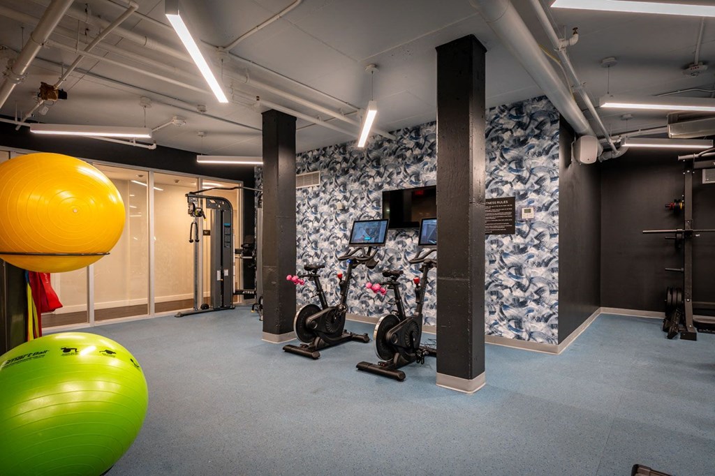 Fitness center with bikes and cable machine at Union 346, Massachusetts, 02143