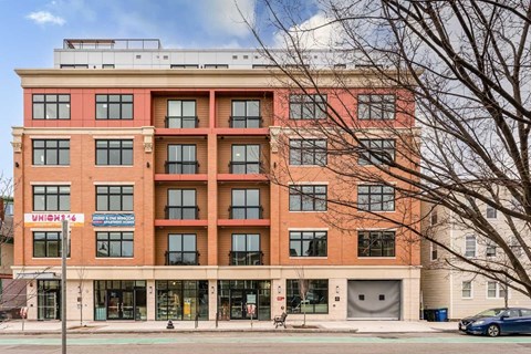 a large brick building with a parking garage in front of it  at Union 346, Somerville, MA, 02143