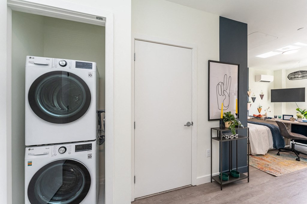 a front loading washer and dryer in a laundry room at Union 346 Apartments, Somerville, 02143