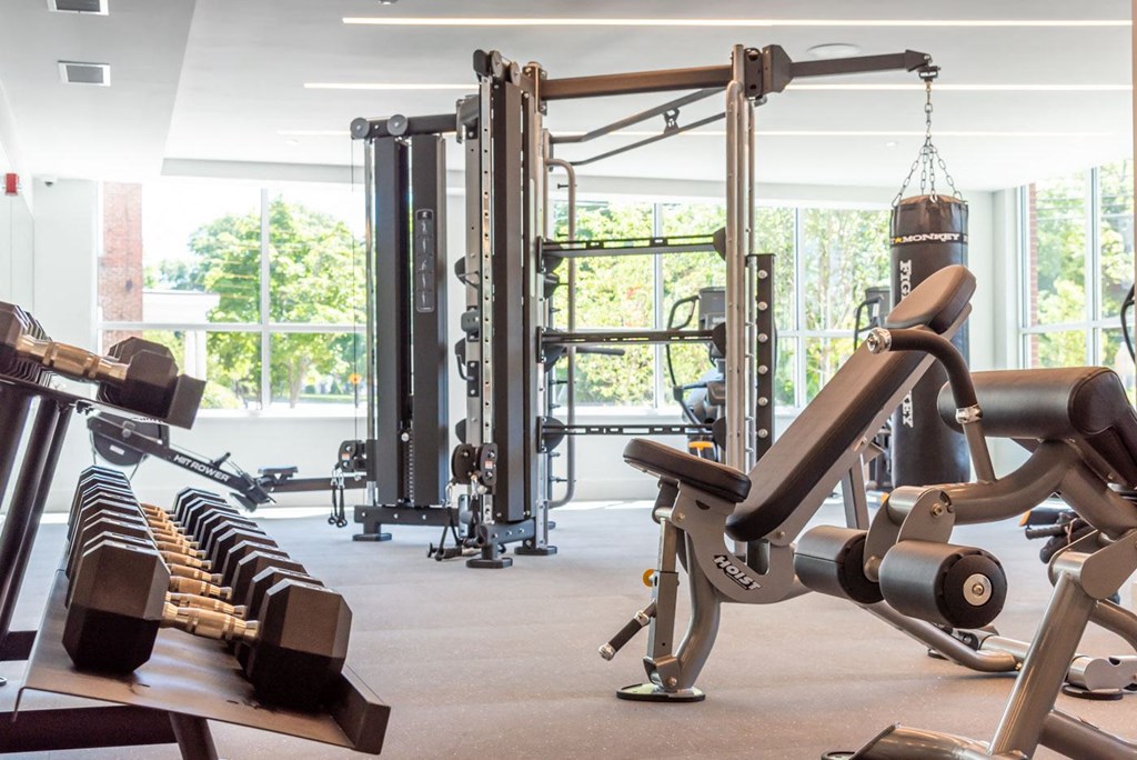 Large fitness center with cardio equipment and free weights in walpole, ma