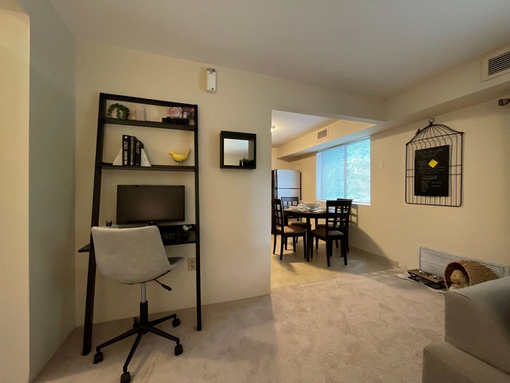 Desk and Chair with View of the Kitchen in Model Apartment
