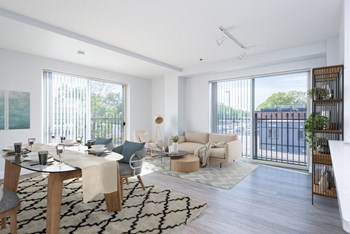 View of the living room and and dining room at Munroe Place in Quincy- virtually staged - Photo Gallery 15