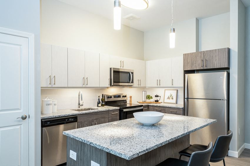 One Wall Street Kitchen with island stainless steel appliances and granite countertops dishwasher