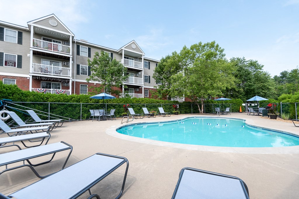 pool deck and foliage with umbrellas