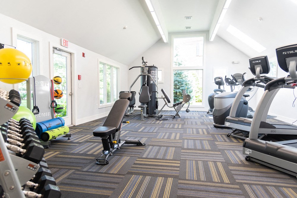 Beverly Commons fitness center benth weights and cardio equipment