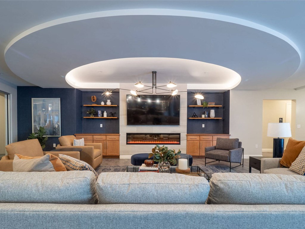 A spacious community room with a mix of modern and comfortable seating.