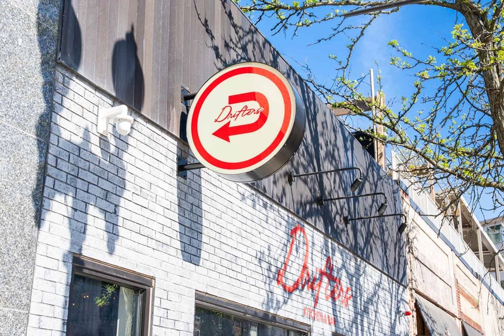 A Dirty Duck sign is on a building.