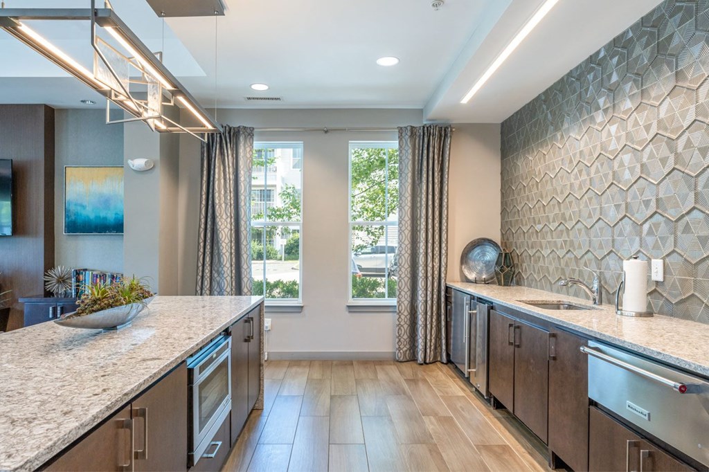 a kitchen with a large counter top and a window