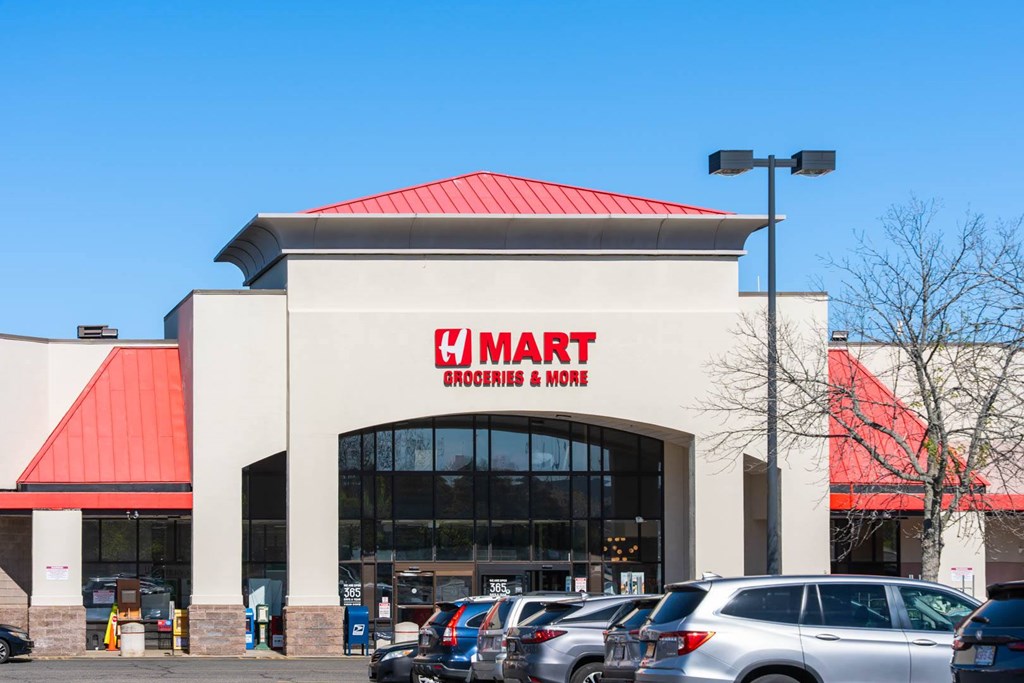 A large store with a red roof and a sign that says
