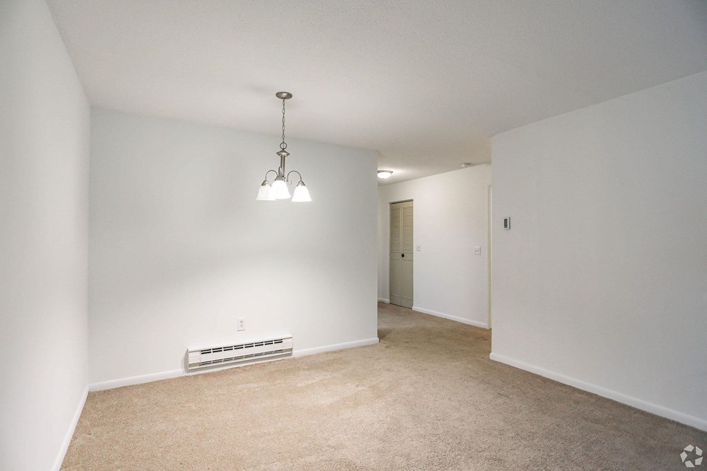 Carpeted living spaces with pendant lighting.