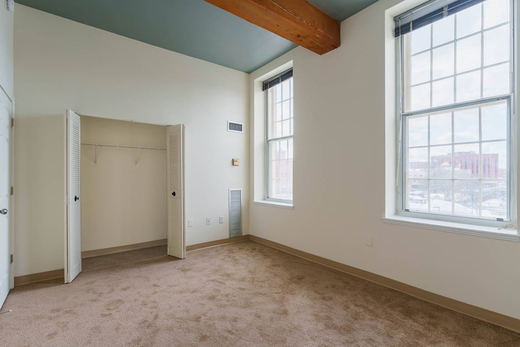 Empty room with a window and a door.