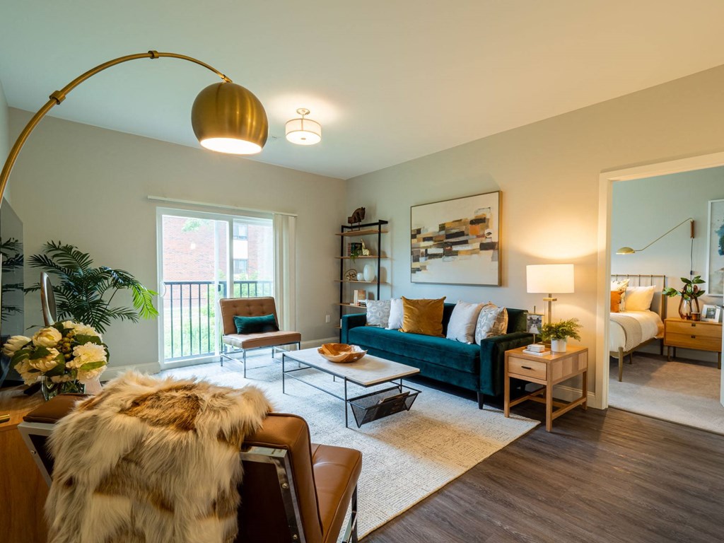 Another living room setup with natural tones, a floor lamp, and decor that seamlessly blends luxury and comfort.
