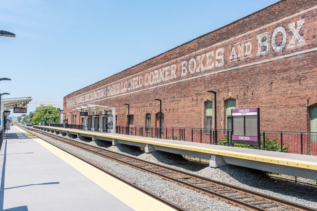 A train station with a sign that says "Boxcar Box and Box".