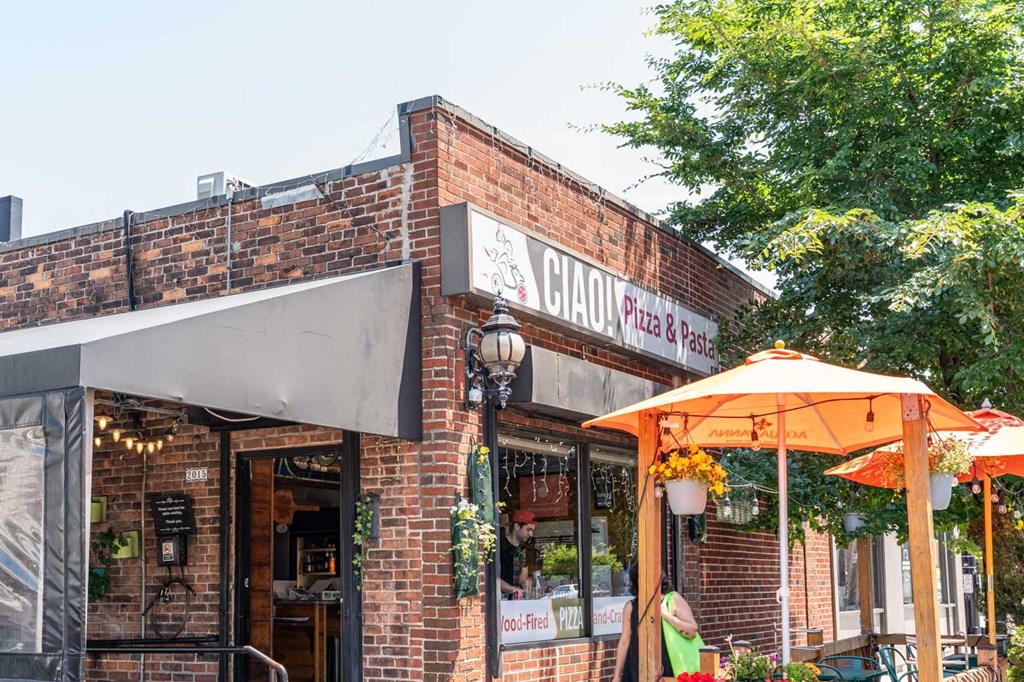 A brick building with a sign that says