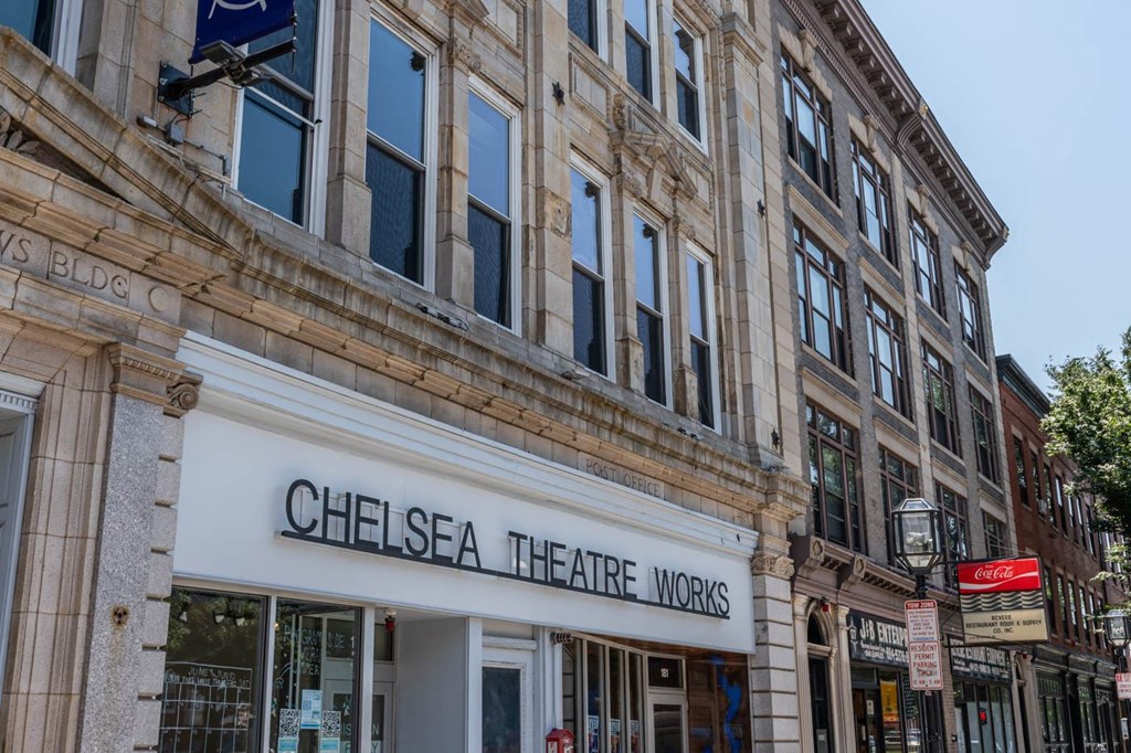 A building with a sign that says Chelsea Theatre Works.