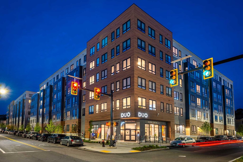A Duo hotel is lit up at night.