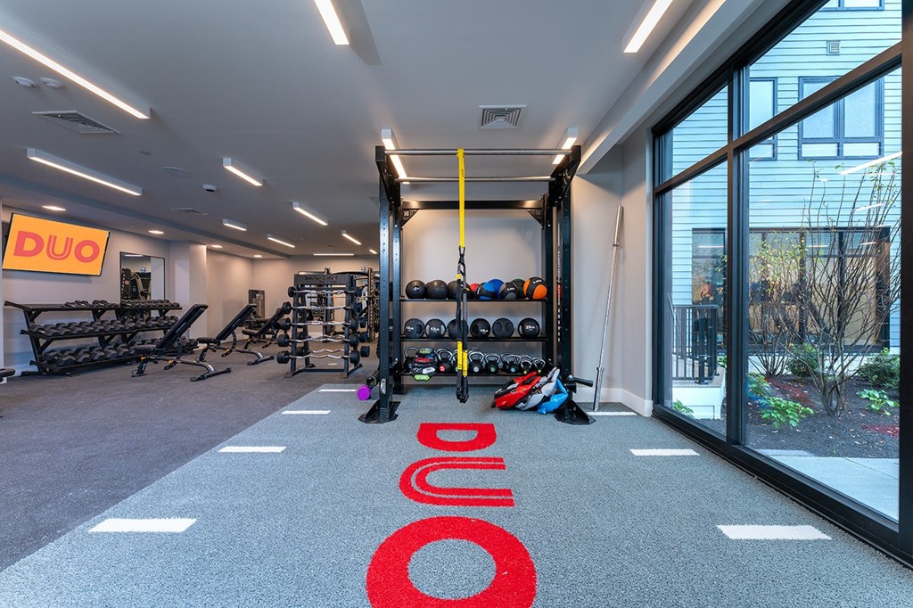 A gym with a red carpet that says DUO.