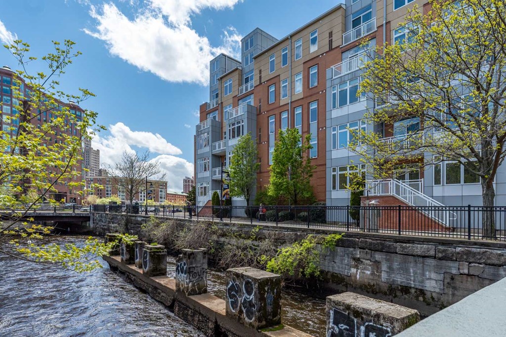a view of a river with a building in the background