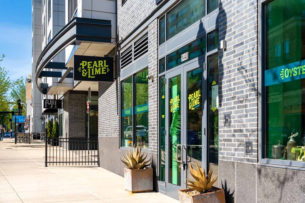 Pearl and time restaurant with green signboard and glass door.