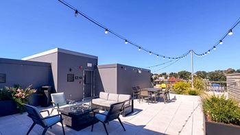 a patio with chairs and tables and lights on a roof at Union 346, Somerville, Massachusetts, 02143