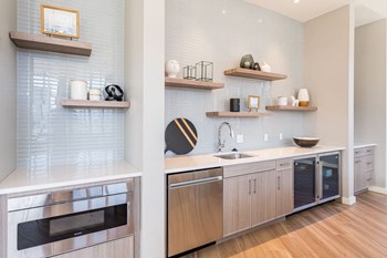 Community lounge kitchen with oven, dishwasher, sink, and refridgerator - Photo Gallery 6