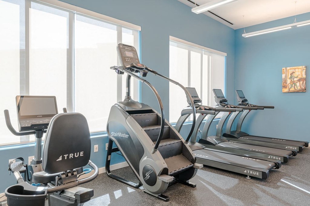 Clubhouse gym cardio equipment, bike, stairmaster, and treadmills