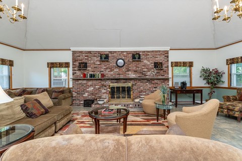A living room with a fireplace and a couch.