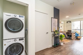 a front load washer and dryer in a laundry room - Photo Gallery 7
