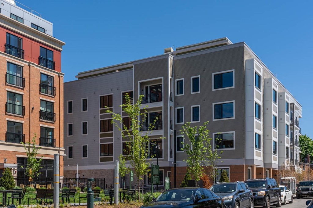 a new apartment building with cars parked in front of it  at Union 346, Somerville, MA 02143
