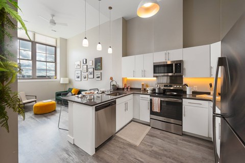 a kitchen with stainless steel appliances and a counter top