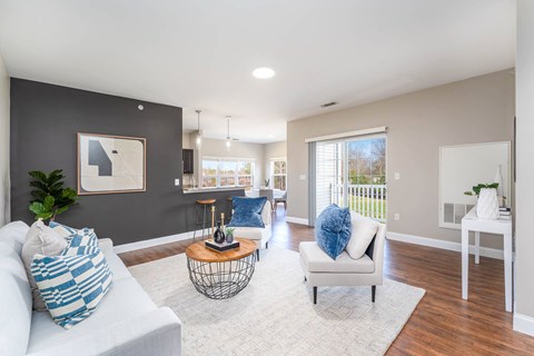 A living room with a white couch and a coffee table.