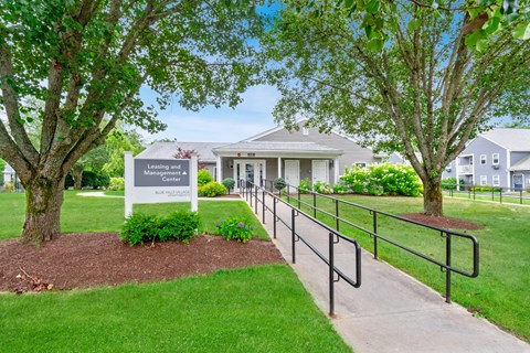 the preserve at ballantyne commons community entrance with trees and a fence at Blue Hills Village, Canton, MA