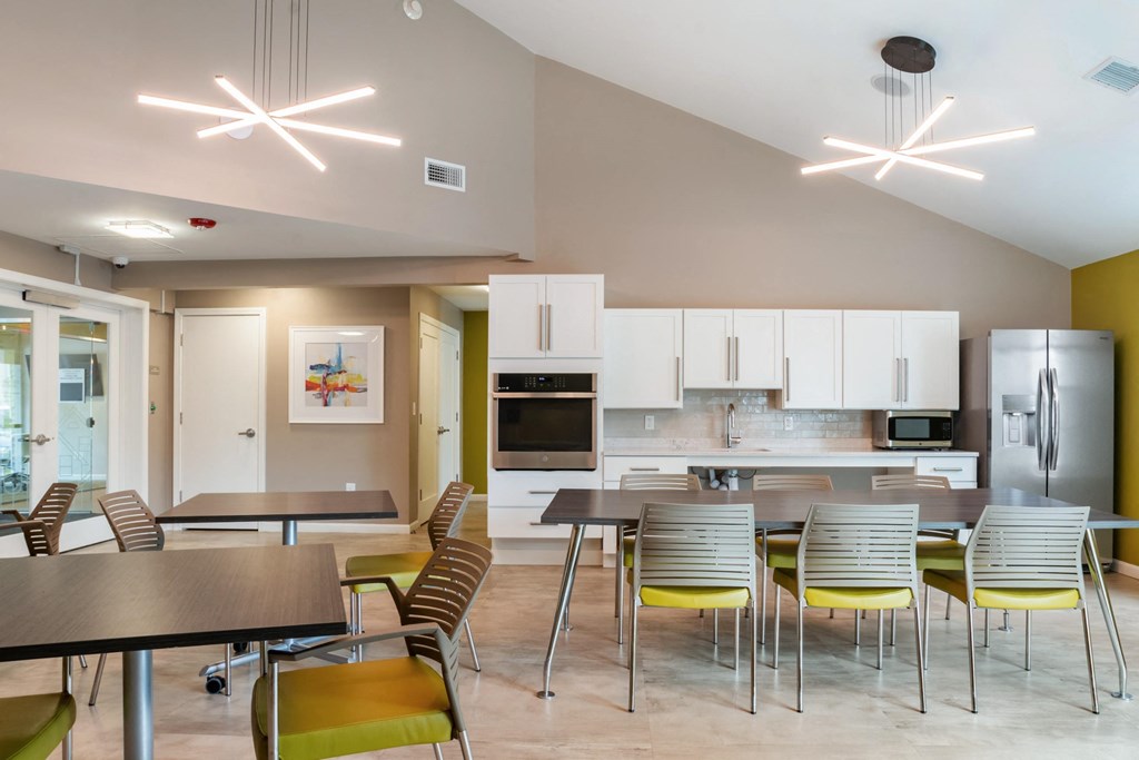 Community room with tables and chairs at Station Pointe Apartments, Mansfield, MA, 02048
