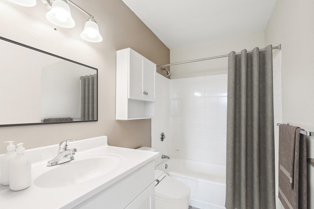 a bathroom with a white sink and a shower at Chapman House, E. Boston, MA, 02128
