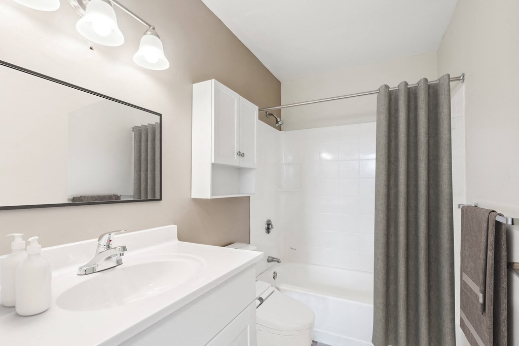 a bathroom with a white sink and a shower at Chapman House, E. Boston, MA, 02128