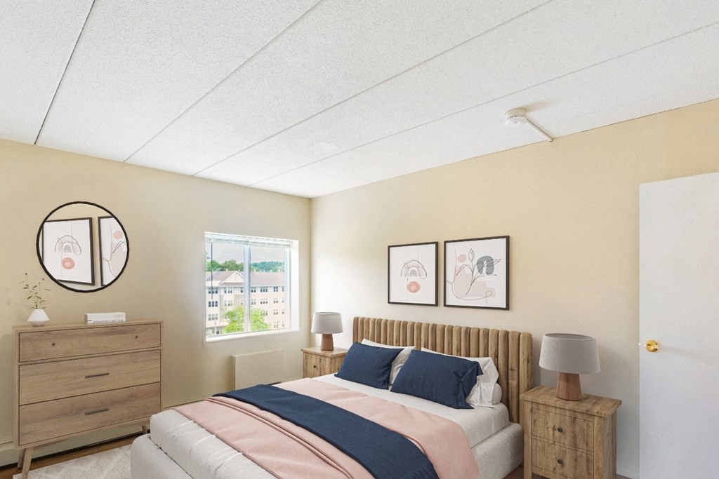 A bedroom with a bed, nightstand, and two framed pictures on the wall at Edmands House, Massachusetts, 01701
