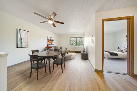 Open concept living and dining room with wood style flooring at Edinlake Apartments, Edinboro, Pennsylvania