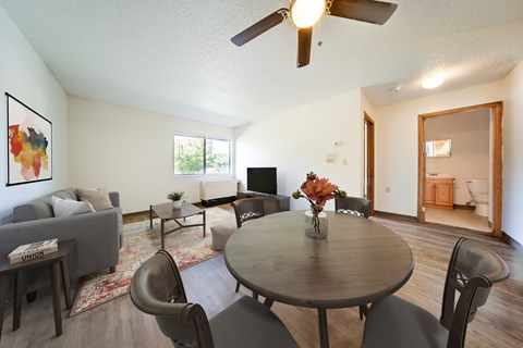 Furnished living area with ceiling fan and bathroom view at Edinlake Apartments, Edinboro