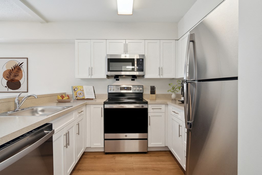Kitchen Layout With Stainless Steel Appliances, White Cabinetry, Open Layout. Mariners Hill, Marshfield, MA.