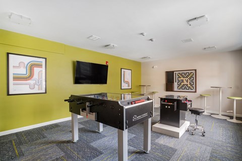 A games room with a pool table and a television at Station Pointe Apartments, Mansfield, MA, 02048