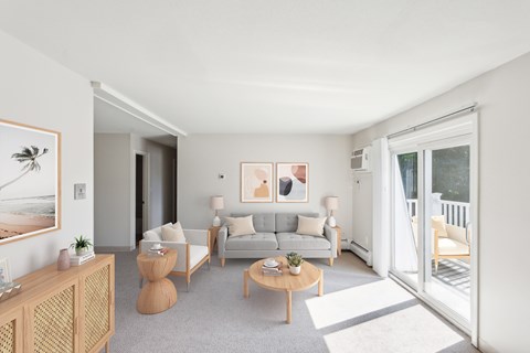 A living room with a grey couch and a coffee table.