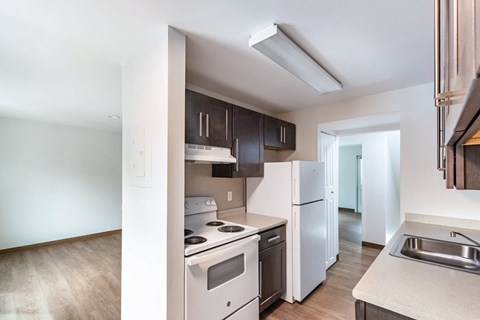 an empty kitchen with white appliances and a white refrigerator at Whittier Terrace, Worcester, MA, 01609