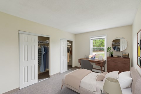 a bedroom with a bed and a closet with a dresser and a mirror at Blue Hills Village, Canton, Massachusetts