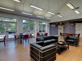 Community Room with Seating and Large Windows. - Photo Gallery 2