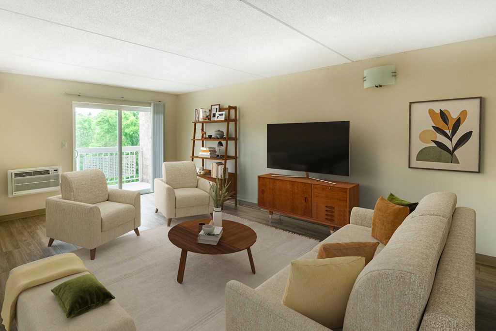 a living room with a couch and chairs and a television at North Stoughton Village, Massachusetts