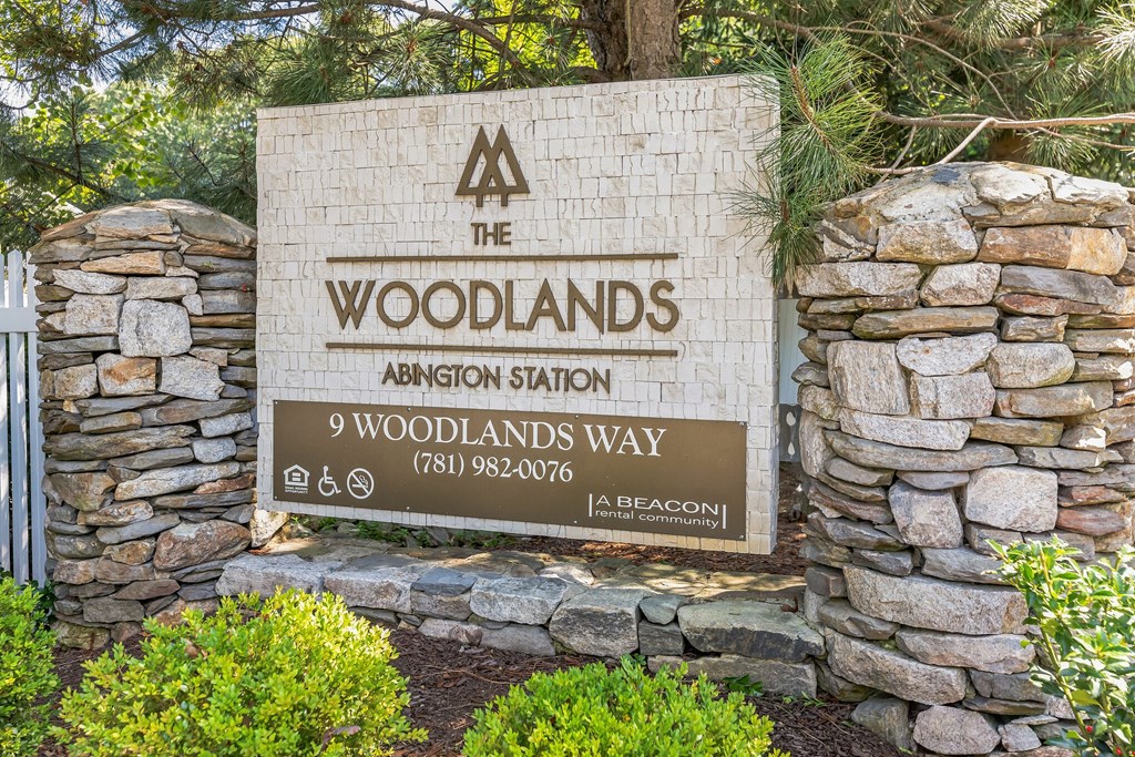 a sign for the woodlands admission station at Woodlands at Abington Station, Massachusetts, 02351