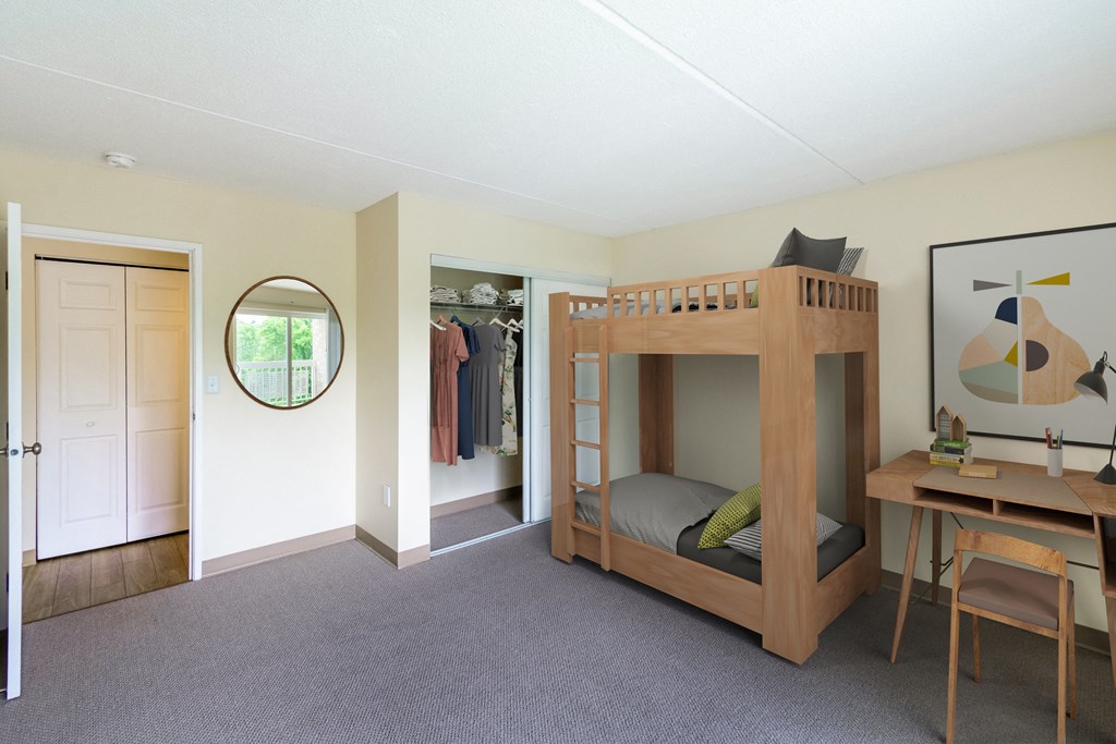 a bunk bed in a room with a desk and a mirror at North Stoughton Village, Massachusetts, 02072