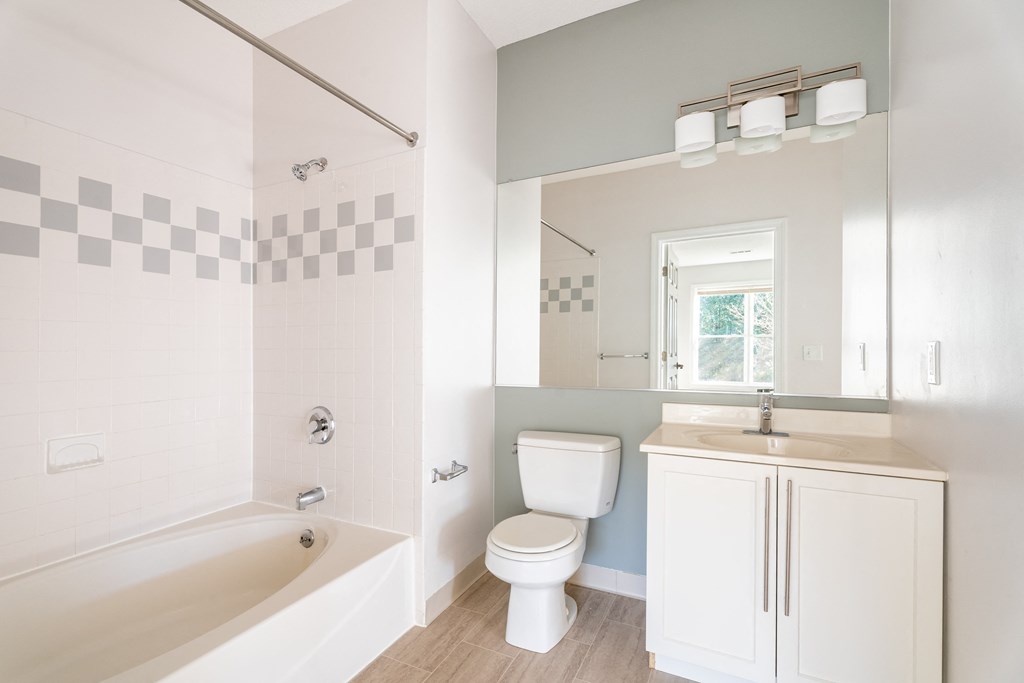a bathroom with a toilet sink and bathtub at Woodlands at Abington Station, Abington, MA, 02351